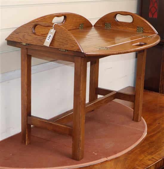 A reproduction oak butlers tray / occasional table